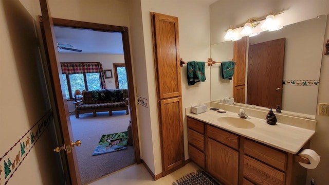 bathroom with ceiling fan and vanity