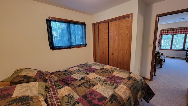 carpeted bedroom featuring a closet