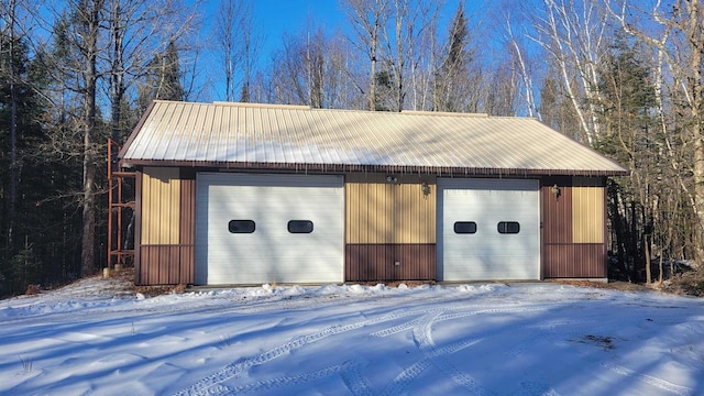 view of snow covered garage