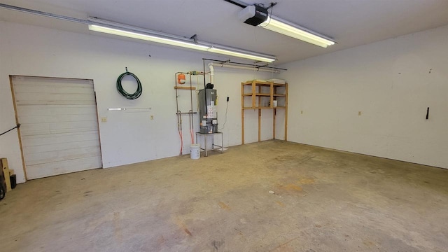 garage with a garage door opener and gas water heater