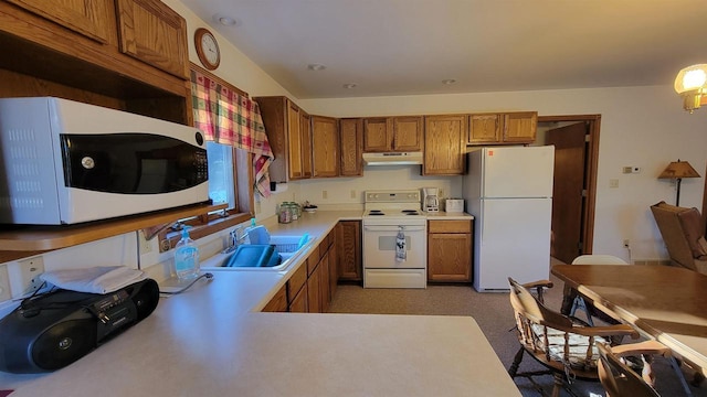 kitchen featuring sink and white appliances