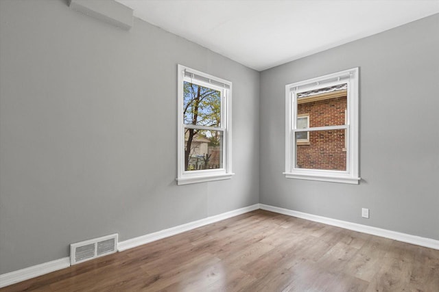 unfurnished room featuring light hardwood / wood-style flooring