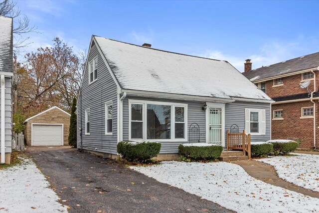 view of front of house with an outdoor structure and a garage