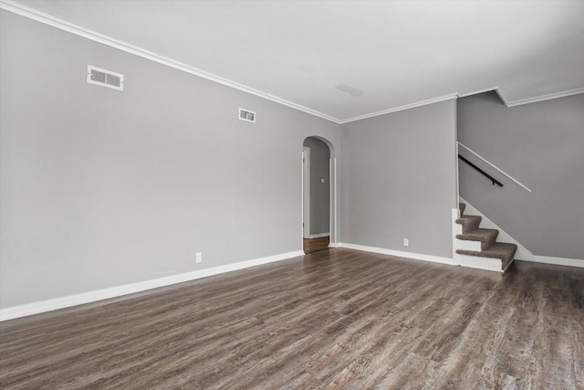 interior space featuring ornamental molding and dark wood-type flooring