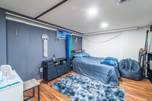 bedroom featuring hardwood / wood-style floors