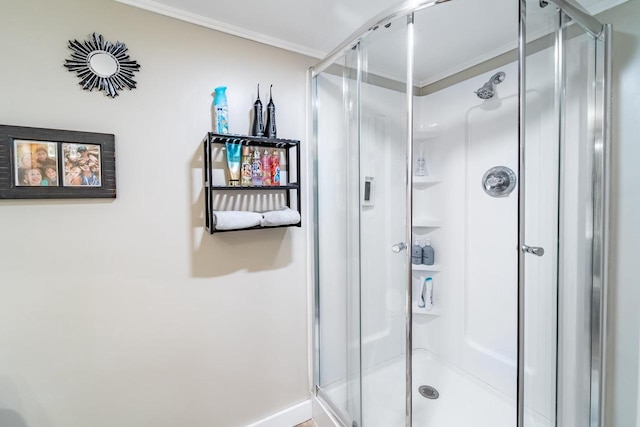 bathroom featuring walk in shower and crown molding