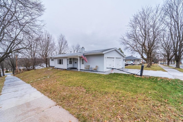 view of front facade with a front lawn and a garage