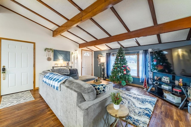 living room featuring vaulted ceiling with beams and dark hardwood / wood-style flooring