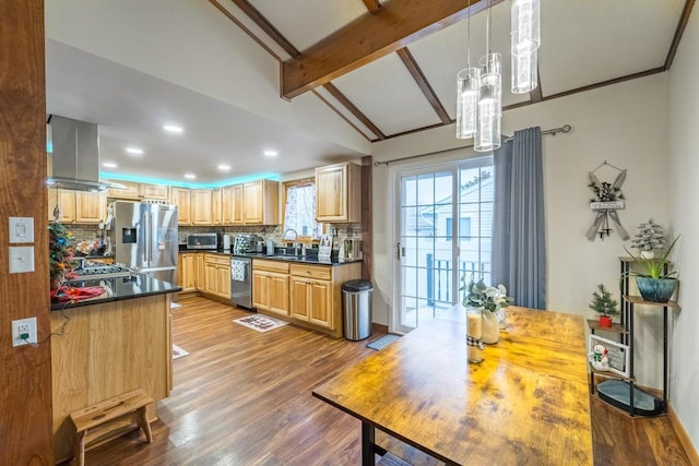 kitchen featuring decorative backsplash, wall chimney exhaust hood, stainless steel appliances, lofted ceiling with beams, and decorative light fixtures