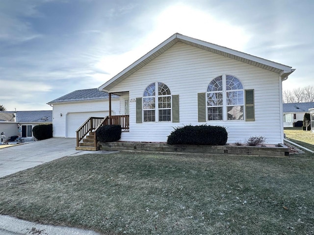 view of front facade with a garage and a front yard