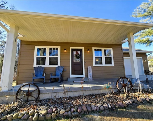 view of front of house with a garage and covered porch