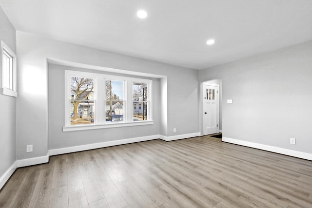 unfurnished room featuring light wood-type flooring