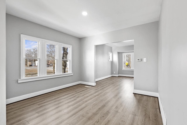 unfurnished room with light hardwood / wood-style flooring