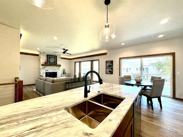 1217 Bay Mist Dr, Green Bay, WI 54311 - kitchen with decorative light fixtures, ceiling fan, a healthy amount of sunlight, and sink