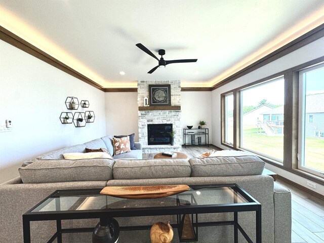 1217 Bay Mist Dr, Green Bay, WI 54311 - living room featuring a fireplace, ceiling fan, plenty of natural light, and hardwood / wood-style flooring