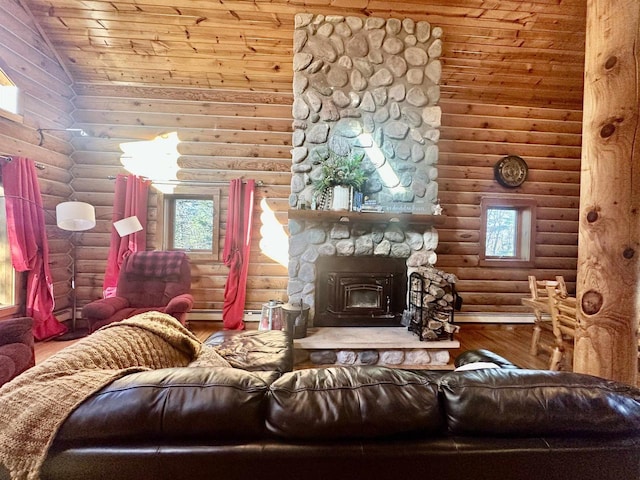 living room with lofted ceiling, a wood stove, log walls, and wooden ceiling