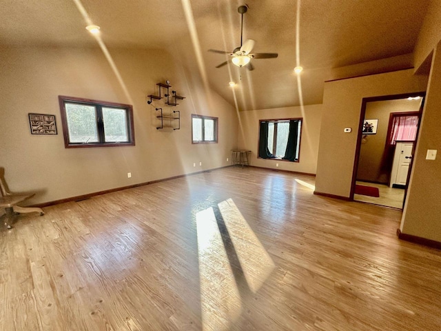 unfurnished living room featuring light hardwood / wood-style flooring and ceiling fan