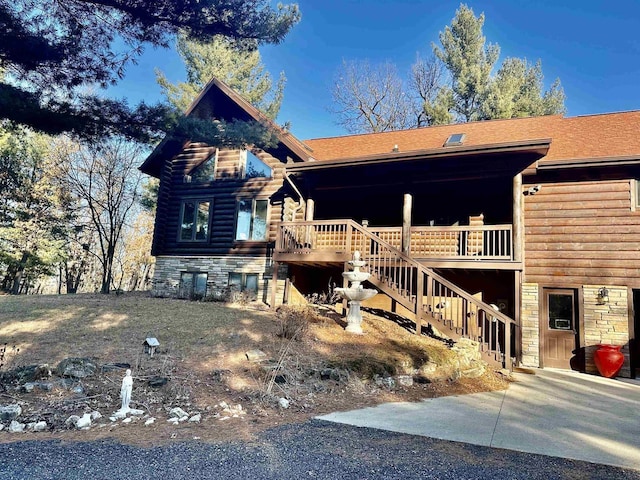 log cabin with a deck