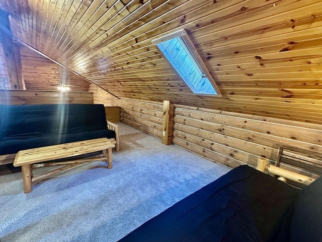 additional living space featuring vaulted ceiling with skylight, wood walls, wood ceiling, and carpet