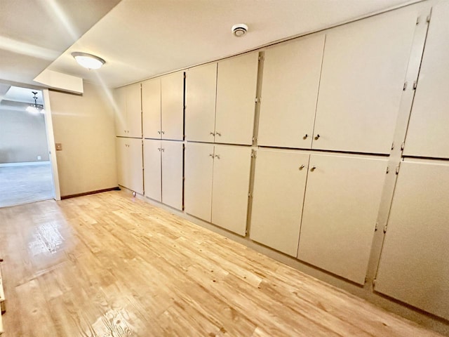 basement featuring light hardwood / wood-style floors