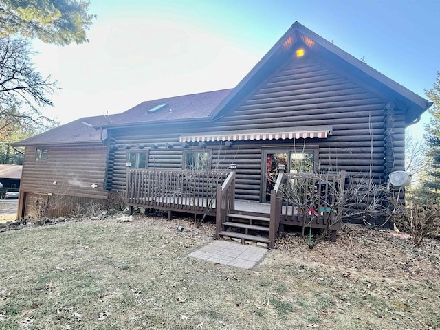 back of property featuring a deck