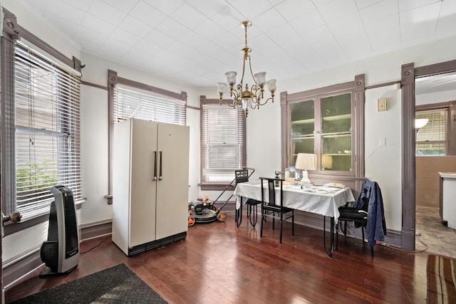 dining room featuring a chandelier and dark hardwood / wood-style floors