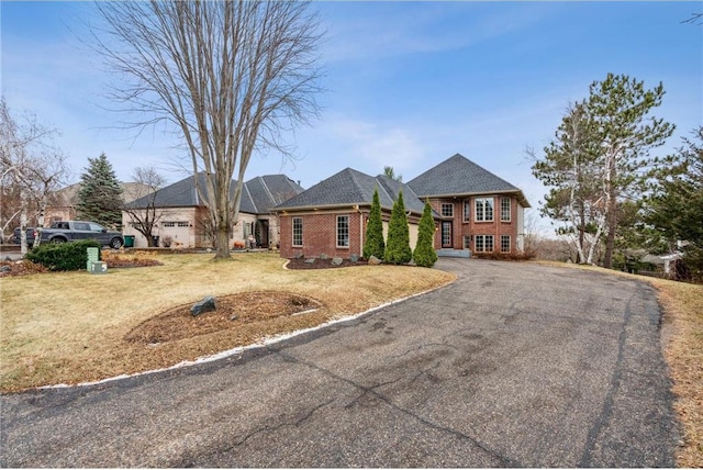 single story home with a front yard