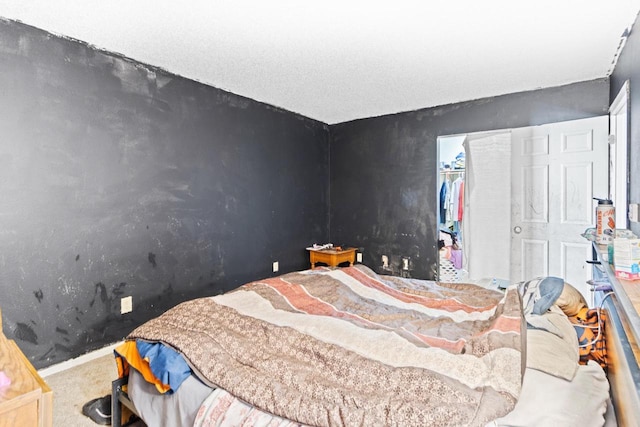 carpeted bedroom with a closet