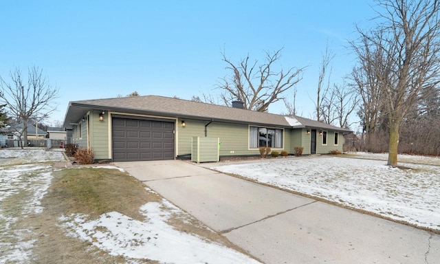 ranch-style home featuring a garage