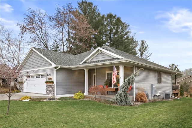 view of front facade featuring a garage, covered porch, a front yard, and central AC