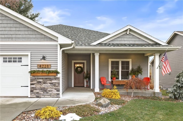 property entrance featuring a porch and a garage