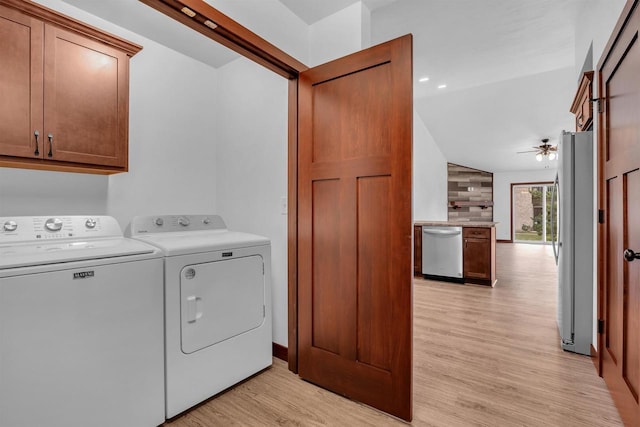 laundry area featuring cabinets, light wood-type flooring, separate washer and dryer, and ceiling fan