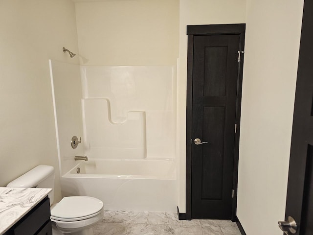 full bathroom featuring bathing tub / shower combination, vanity, and toilet