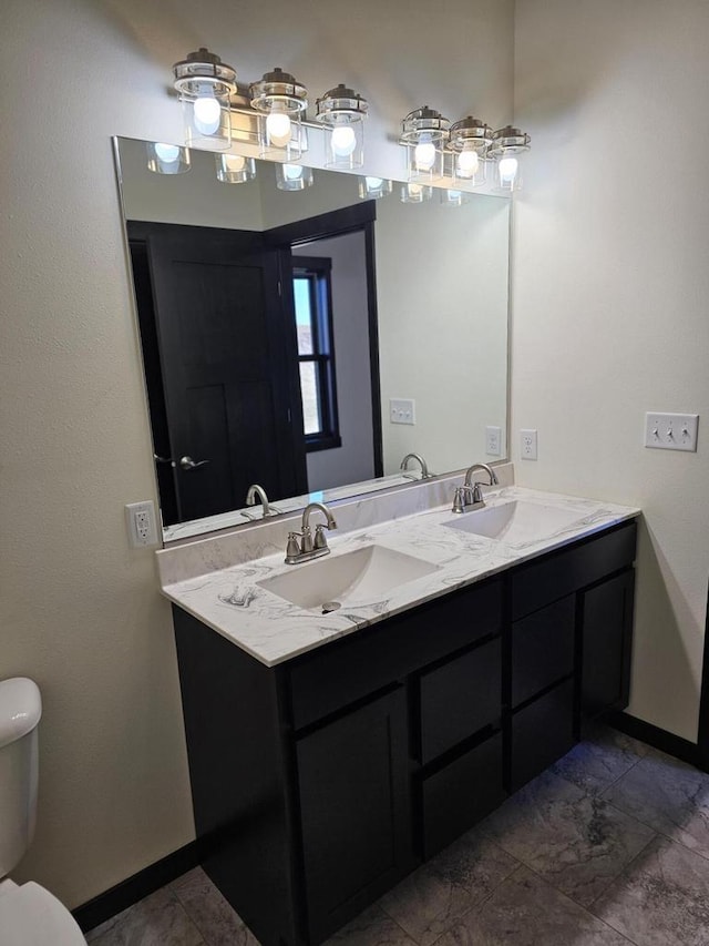 bathroom with vanity and toilet