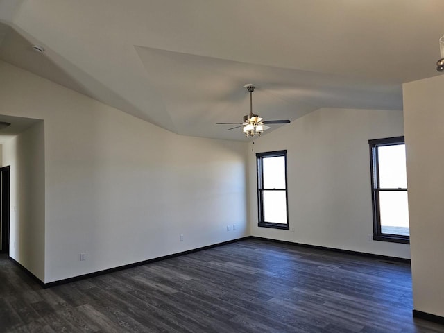 unfurnished room featuring dark hardwood / wood-style floors, ceiling fan, lofted ceiling, and a wealth of natural light