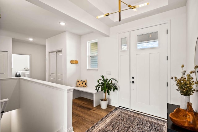 foyer with washer and clothes dryer and wood-type flooring