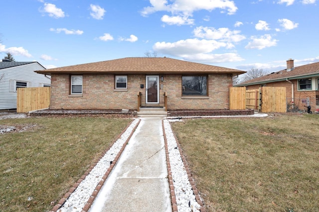 ranch-style house featuring a front lawn