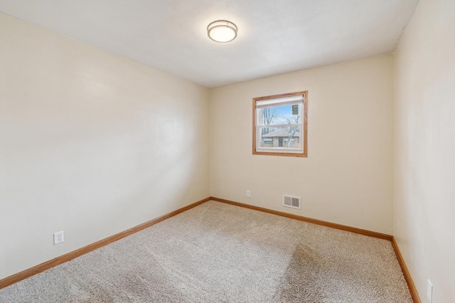 unfurnished room featuring carpet