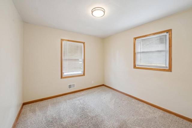 spare room featuring carpet floors