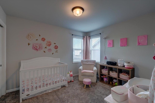 carpeted bedroom featuring a crib