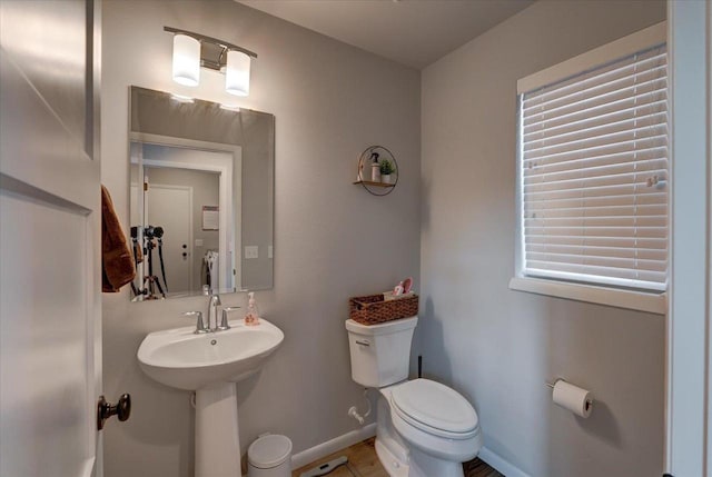 bathroom with sink and toilet