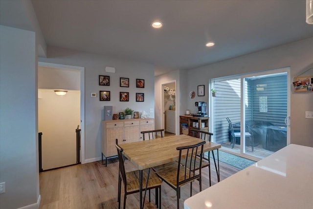 dining space featuring light wood-type flooring