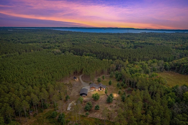 aerial view at dusk with a water view