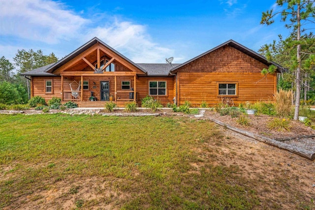 view of front of property with a front yard and covered porch