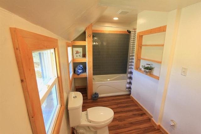 bathroom with shower / tub combo with curtain, wood-type flooring, vaulted ceiling, and toilet