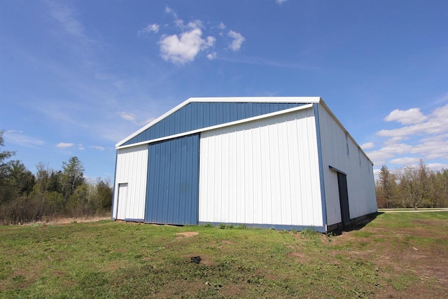 view of outbuilding with a lawn