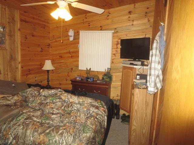 bedroom with ceiling fan and wooden ceiling