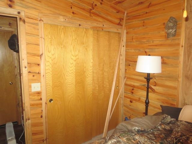 bedroom with log walls