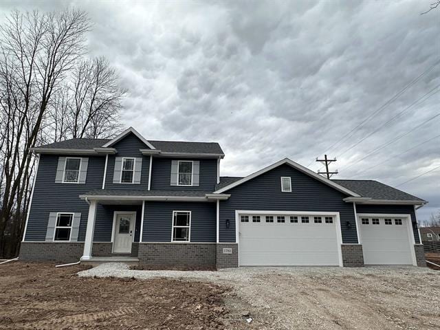 view of front of property featuring a garage