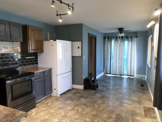 kitchen with stainless steel electric stove, backsplash, ceiling fan, and white fridge